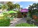 Outdoor seating area and entrance to Turtles on Little Sarasota Bay restaurant with lush landscaping at 8764 Midnight Pass Rd # A301, Sarasota, FL 34242