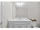 Well-lit white bathroom features a vanity with modern fixtures and a convenient toilet at 11419 Gallatin Trl, Parrish, FL 34219