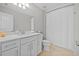 Clean, white bathroom features a sink with modern vanity and a bathtub with shower curtain at 11419 Gallatin Trl, Parrish, FL 34219