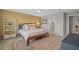 Warm and inviting bedroom featuring a comfortable bed, area rug, and a calming, neutral color scheme at 11419 Gallatin Trl, Parrish, FL 34219