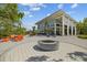 Outdoor social area features a fire pit and lounge chairs for residents to enjoy the outdoors at 11419 Gallatin Trl, Parrish, FL 34219