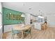 Open concept dining area next to the kitchen, featuring stylish decor at 11419 Gallatin Trl, Parrish, FL 34219