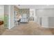 Open hallway boasts a modern desk, stylish wallpaper, and neutral tones, creating an inviting and functional space at 11419 Gallatin Trl, Parrish, FL 34219