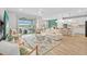Open-concept living room with a view of the backyard pool and patio at 11419 Gallatin Trl, Parrish, FL 34219