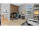Home office space with desk setup, wood accent wall and natural light at 11419 Gallatin Trl, Parrish, FL 34219