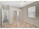 Bedroom with tile floors, a closet with mirrored doors, and a window with blinds at 11734 Winding Woods Way, Lakewood Ranch, FL 34202