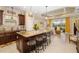 Elegant kitchen featuring a large island with bar seating and granite countertops at 12019 Sawgrass Lake Ter, Bradenton, FL 34211