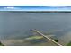 Stunning aerial view of a long fishing pier extending into the water at 1620 Fairway Trce # B, Palmetto, FL 34221