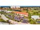 Aerial view of the condominium building with a red roof, parking, and community landscaping at 1620 Fairway Trce # B, Palmetto, FL 34221