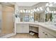 Bright bathroom featuring a tiled shower, double vanity, and ample lighting for a refreshing and functional space at 1620 Fairway Trce # B, Palmetto, FL 34221