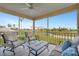 Inviting screened lanai offers comfortable seating and serene views of the golf course and water at 1620 Fairway Trce # B, Palmetto, FL 34221