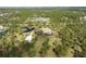 Breathtaking aerial shot of a countryside estate with multiple ponds surrounded by trees at 20010 71St E Ave, Bradenton, FL 34211