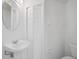 Cozy bathroom with a pedestal sink, toilet, and storage space, with all-white fixtures at 208 Cape Harbour Loop # 108, Bradenton, FL 34212