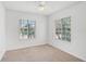 Bright bedroom featuring carpet, natural lighting, and two large windows at 208 Cape Harbour Loop # 108, Bradenton, FL 34212