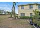 View of the side and backyard of the property showing lush vegetation and exterior finishes at 208 Cape Harbour Loop # 108, Bradenton, FL 34212