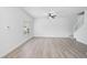 Spacious living room featuring vinyl flooring, a modern ceiling fan, and lots of natural light at 208 Cape Harbour Loop # 108, Bradenton, FL 34212