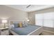Cozy bedroom featuring a comfortable queen bed, soft lighting, and a ceiling fan at 209 111Th E St, Bradenton, FL 34212