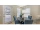 Bright dining area with natural light, and stylish light fixture at 209 111Th E St, Bradenton, FL 34212