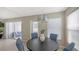 Dining area with sliding door to a patio and stylish silver light fixture at 209 111Th E St, Bradenton, FL 34212