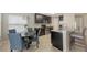 Modern eat-in kitchen featuring stainless steel appliances, dark cabinetry, and stylish fixtures at 209 111Th E St, Bradenton, FL 34212