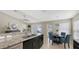 Open kitchen with granite countertops, dark cabinetry, and stainless steel sink at 209 111Th E St, Bradenton, FL 34212