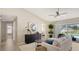 Open-concept living room with neutral tones, modern furnishings, and access to a pool view at 209 111Th E St, Bradenton, FL 34212