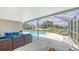 Screened-in lanai with outdoor seating and a swimming pool at 209 111Th E St, Bradenton, FL 34212