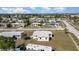 Aerial view of a residential neighborhood showcasing cozy homes and well-maintained streets in a coastal town at 211 Dalton Blvd, Port Charlotte, FL 33952