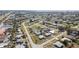 High-angle view showcasing layout of neighborhood with streets, residences, landscaping, and community features at 211 Dalton Blvd, Port Charlotte, FL 33952