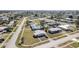 Wide aerial view of residential neighborhood showcasing many homes, streets and community layout at 211 Dalton Blvd, Port Charlotte, FL 33952
