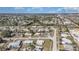 Extended aerial shot showing neighborhood layout, street patterns, and densely packed houses within community at 211 Dalton Blvd, Port Charlotte, FL 33952