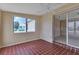 Comfortable sun room with tile flooring, ceiling fan, and natural light streaming through large windows at 211 Dalton Blvd, Port Charlotte, FL 33952