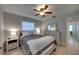 Comfortable bedroom featuring a ceiling fan, neutral tones, and lots of natural light at 2428 Whippoorwill Cir, Sarasota, FL 34231