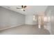 Open-concept living room with tile flooring and a view of the kitchen at 3769 Parkridge Cir # 4-103, Sarasota, FL 34243