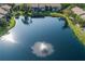 Water view showcasing beautiful landscaping, serene setting, and sparkling fountain at 3810 75Th W St # 123, Bradenton, FL 34209