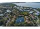 Beautiful aerial view of community featuring pond, lush landscaping, and views of the bay at 3810 75Th W St # 123, Bradenton, FL 34209