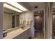 Bathroom with large mirror, good lighting, and tiled walk-in shower at 3810 75Th W St # 123, Bradenton, FL 34209