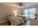 Bedroom features ceiling fan, wood floors, and two twin beds at 3810 75Th W St # 123, Bradenton, FL 34209