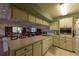 Functional kitchen with ample counter space, modern appliances, and open access to the inviting meeting area at 3810 75Th W St # 123, Bradenton, FL 34209