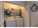 Convenient laundry closet with a full-size washer and dryer and plenty of storage on the shelves at 3810 75Th W St # 123, Bradenton, FL 34209