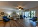 Living room featuring wood-look floors and sliding doors to lanai at 3810 75Th W St # 123, Bradenton, FL 34209