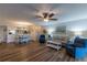 Spacious open concept living area with wood-look floors and an adjacent dining area at 3810 75Th W St # 123, Bradenton, FL 34209
