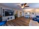 Open concept living area features wood-look floors with views to the dining area at 3810 75Th W St # 123, Bradenton, FL 34209
