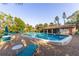 Outdoor pool featuring lounge chairs and tables perfect for community enjoyment at 3810 75Th W St # 123, Bradenton, FL 34209
