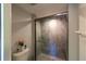 Glass shower features gray tile and sleek fixtures at 3810 75Th W St # 123, Bradenton, FL 34209