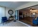 Inviting sunroom featuring tiled floors, comfortable seating, and sliding glass doors to the living room at 3810 75Th W St # 123, Bradenton, FL 34209