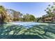Community tennis courts surrounded by lush foliage and greenery at 3810 75Th W St # 123, Bradenton, FL 34209