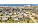 This fantastic aerial view captures the neighborhood with beach and ocean views off in the distance at 432 W Gate Dr, Venice, FL 34285