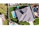 Aerial view of the property showcasing a pool, patio, lush lawn, and well-maintained landscaping at 432 W Gate Dr, Venice, FL 34285