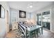 Serene bedroom with a comfy bed, soft lighting, and a sliding glass door at 432 W Gate Dr, Venice, FL 34285
